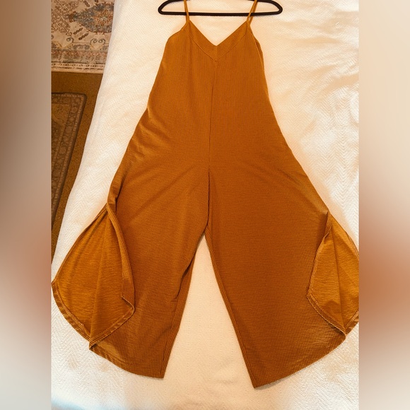 Eyeshadow Pants - Flowy Wide-Leg Jumpsuit in Rustic Red. Perfect for a go to Outfit